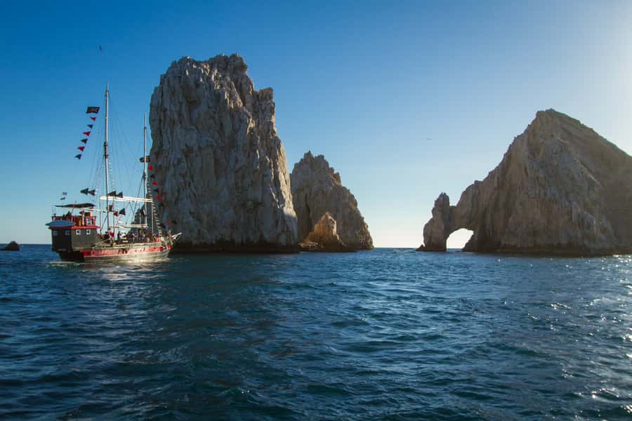 Cabo San Lucas: Pirate Cruise with Snorkel Treasure Hunt - Following the map past Cabo’s signature rocks