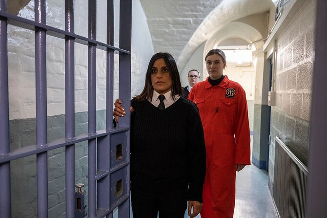 Shepton Mallet Prison Escape Room - The Hole - Prison guards Will and Georgina set the mood